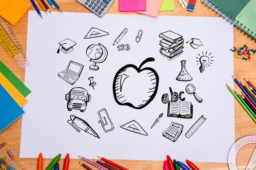 Composite image of education doodles against students desk