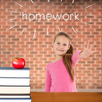 The word homework and cute girl with hand out against red apple on pile of books