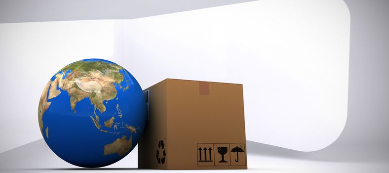 3D image of planet Earth and box against abstract room