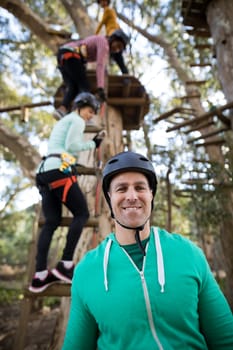 Portrait of smiling man standing in park on a sunny day