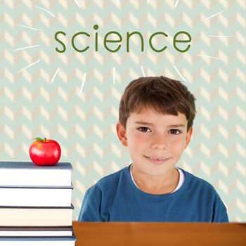 The word science and cute boy smiling against red apple on pile of books