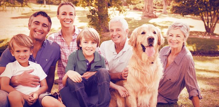 Portrait of happy family smiling with dog