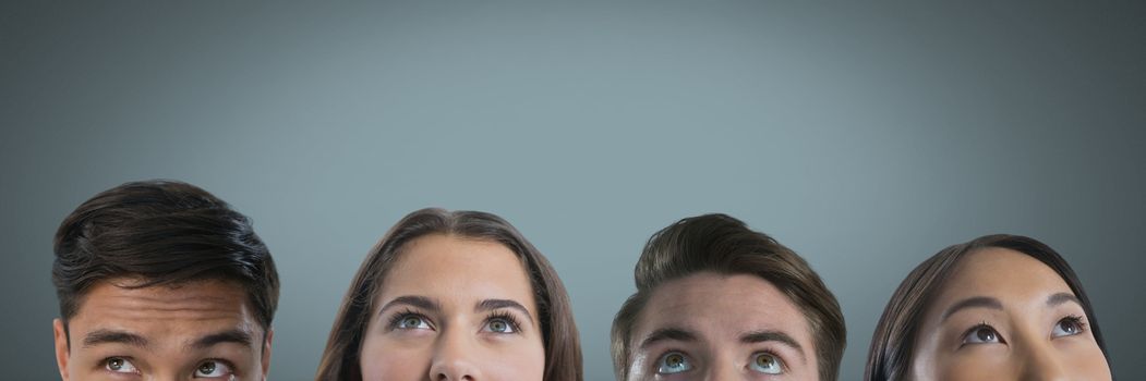 Digital composite of Four people looking up with grey background