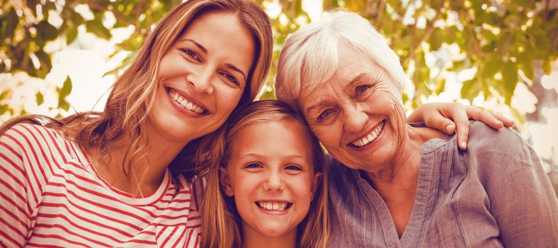 Portrait of happy family with granny standing outdoors