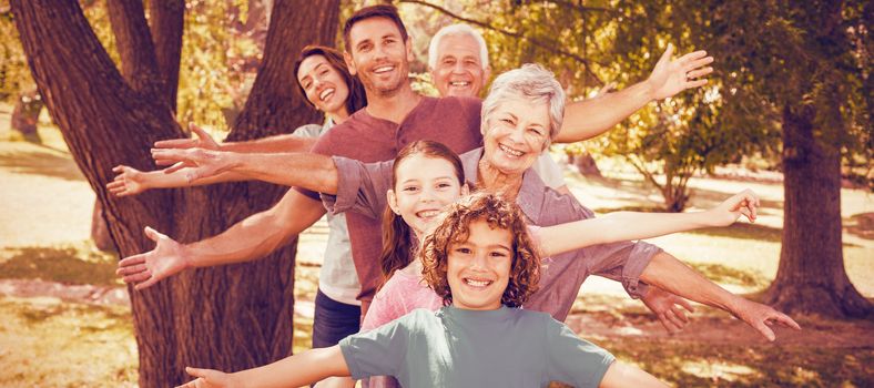 Portrait of family smiling in park 