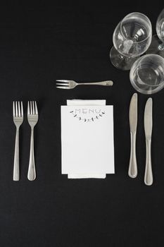 Black theme table setting with menu card 