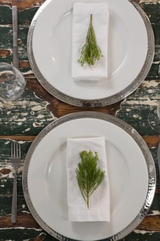 Overhead of table setting on weathered wooden plank