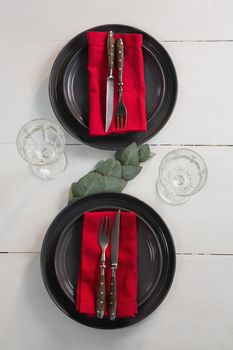 Overhead of elegance table setting on wooden plank