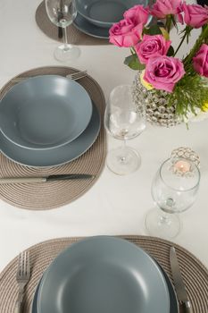 Overhead view of plate and cutlery set elegantly on a table