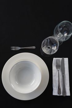 Overhead view of black theme table setting