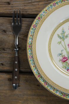 Close-up of elegance table setting on wooden plank