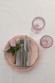 Overhead view of beautiful table setting with floral arrangement 