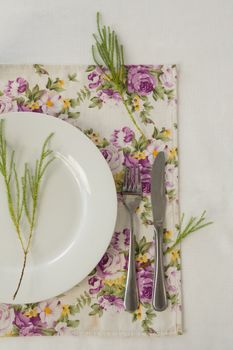 Overhead of elegance table setting on white background