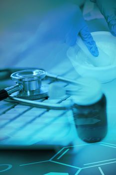 Digital background with emergency sign  against close-up of keyboard with stethoscope