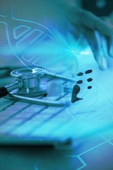 Digital background with emergency sign  against close-up of keyboard with stethoscope