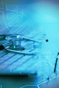 Medical icons set against close-up of keyboard with stethoscope