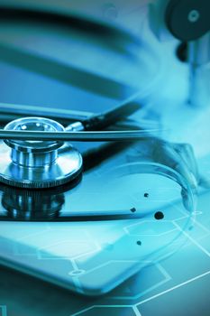 Digital background with brain sign  against stethoscope on digital tablet