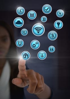 Digital composite of Businesswoman touching various business icons