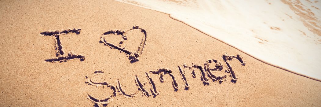 I love summer written on sand at beach