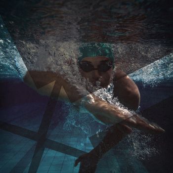 Fit swimmer training by himself in the swimming pool at the leisure centre