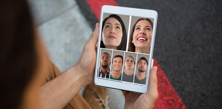 People collage portrait 7 wide against cropped hands of man holding tablet