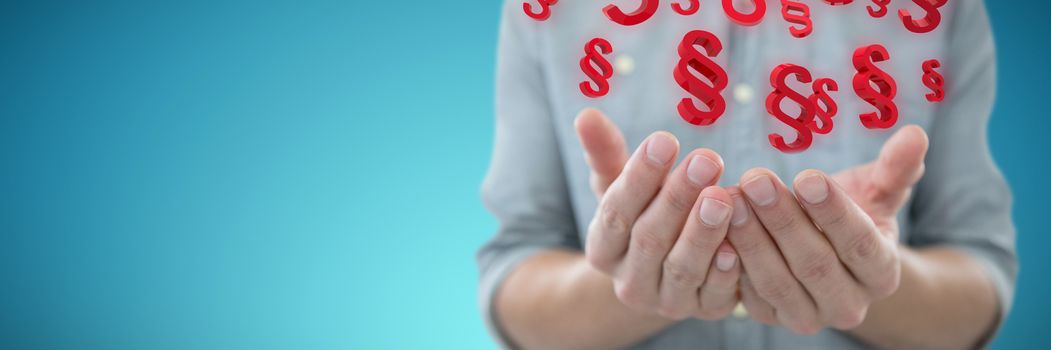 Cupped hands of man holding invisible object against abstract blue background