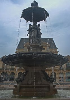 CHERBOURG, FRANCE - June 6th 2019 - impressive fountain with theater building behind it