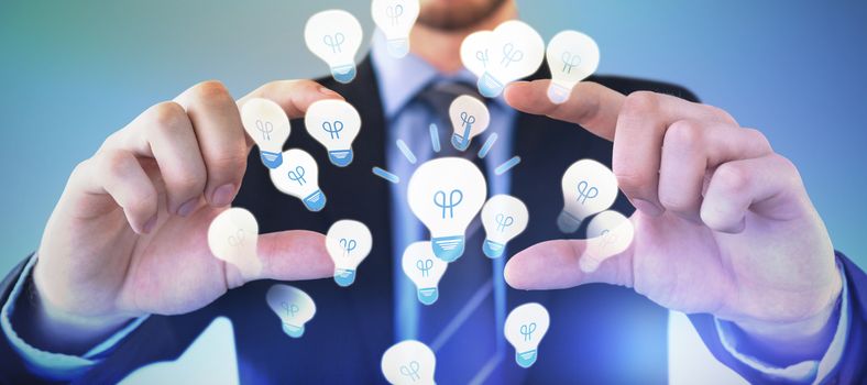 Mid section of businessman wearing suit while advertising invisible product against abstract blue background