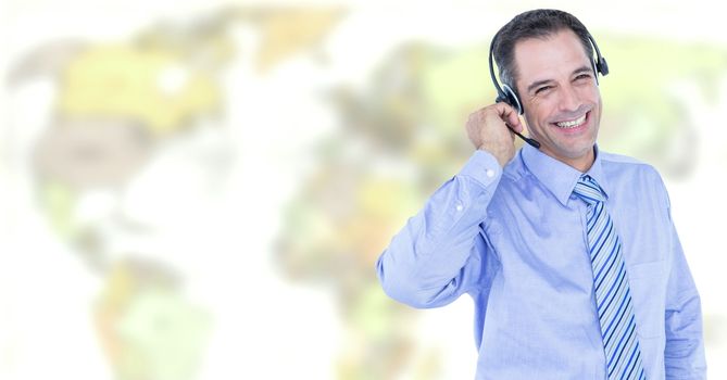 Digital composite of Travel agent man wearing headset in front of world map