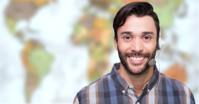 Digital composite of Travel agent man wearing headset in front of world map