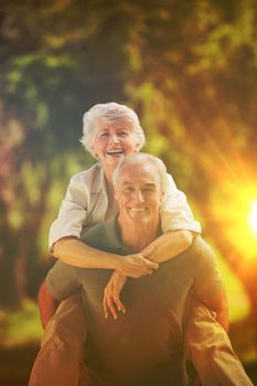 Man giving wife a piggyback