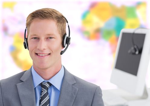 Digital composite of Travel agent man wearing headset in front of world map