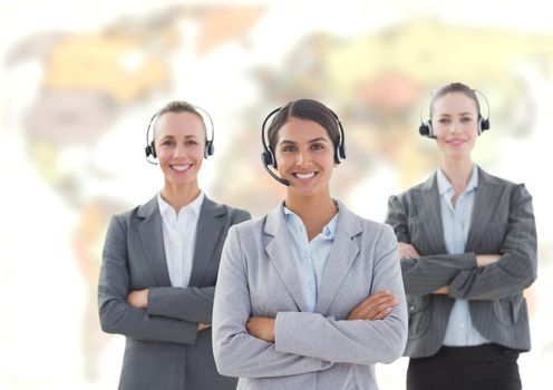 Digital composite of Travel agents wearing headset in front of world map