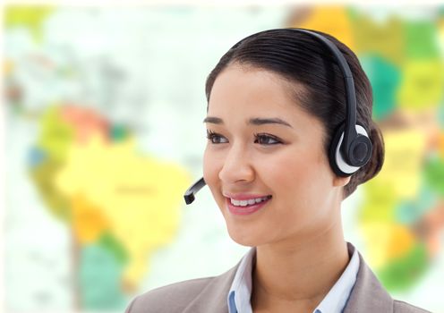 Digital composite of Travel agent woman wearing headset in front of world map