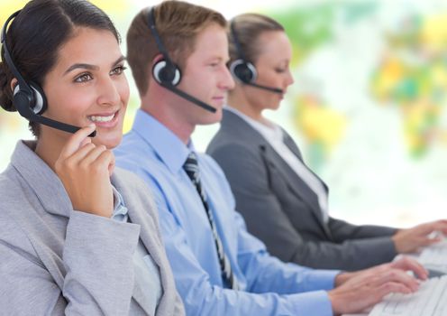 Digital composite of Travel agents wearing headsets in front of world map