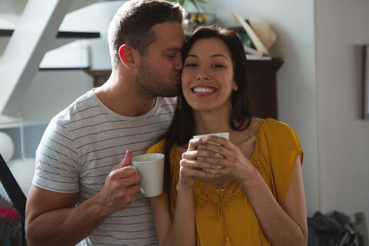 Romantic couple having coffee at home