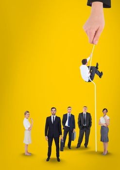 Digital composite of Hand choosing a man with a rope on a yellow background with business people