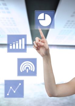 Digital composite of Hand touching business chart statistic icons