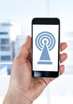 Digital composite of Hand holding phone with signal icon