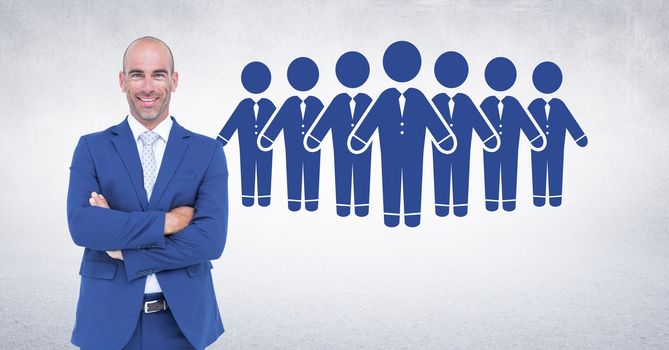 Digital composite of Businessman folding arms with people group icons