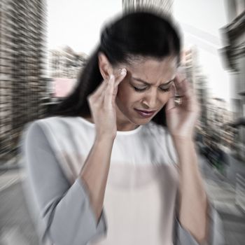 Businesswoman having an headache against new york street