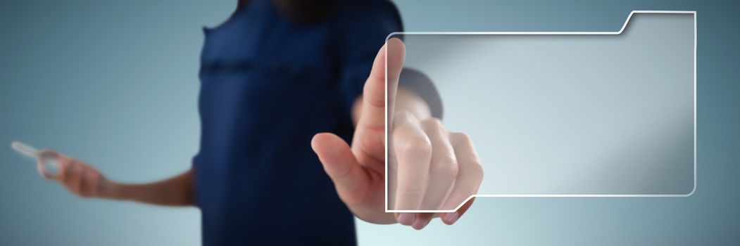 Female executive pressing an invisible virtual screen against abstract grey background