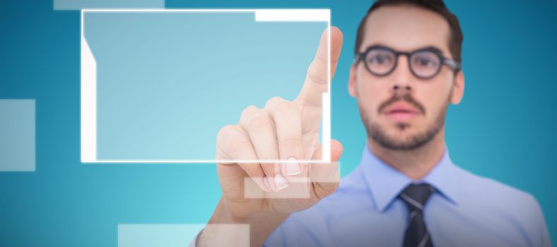 Businessman with glasses pointing something against abstract blue background