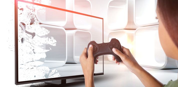 Woman playing video game against white background against white abstract room
