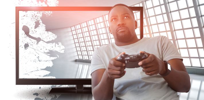 Man playing video game against white background against abstract room