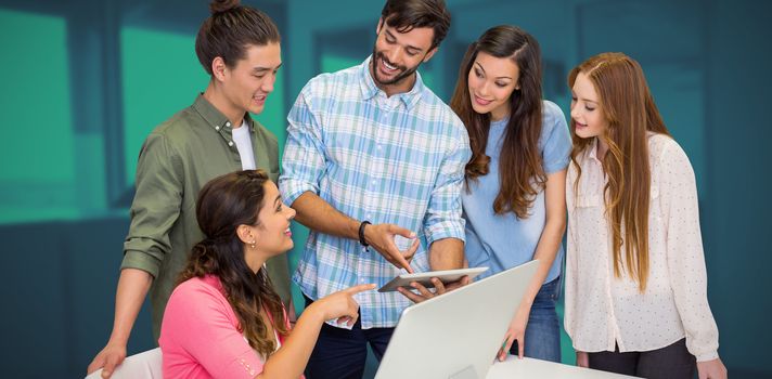 Business people discussing over tablet against modern office