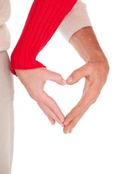 Close up of hands forming heart over white background