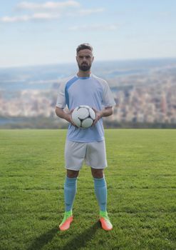 Digital composite of Soccer player on grass with city