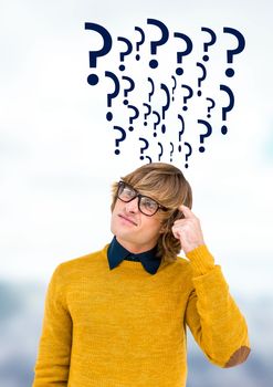 Digital composite of Man thinking with quirky question marks