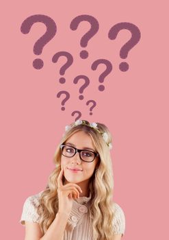 Digital composite of Woman thinking with stitched question marks